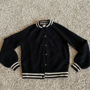 Black cardigan with off white trim. In great condition, super soft.